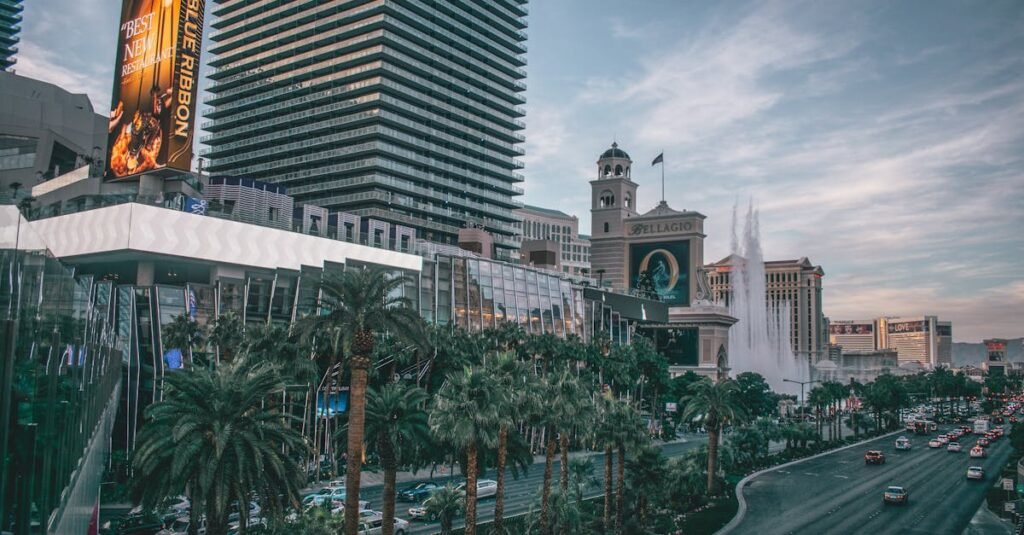 Vibrant view of Las Vegas's iconic skyline and busy boulevard with modern buildings and neon lights.