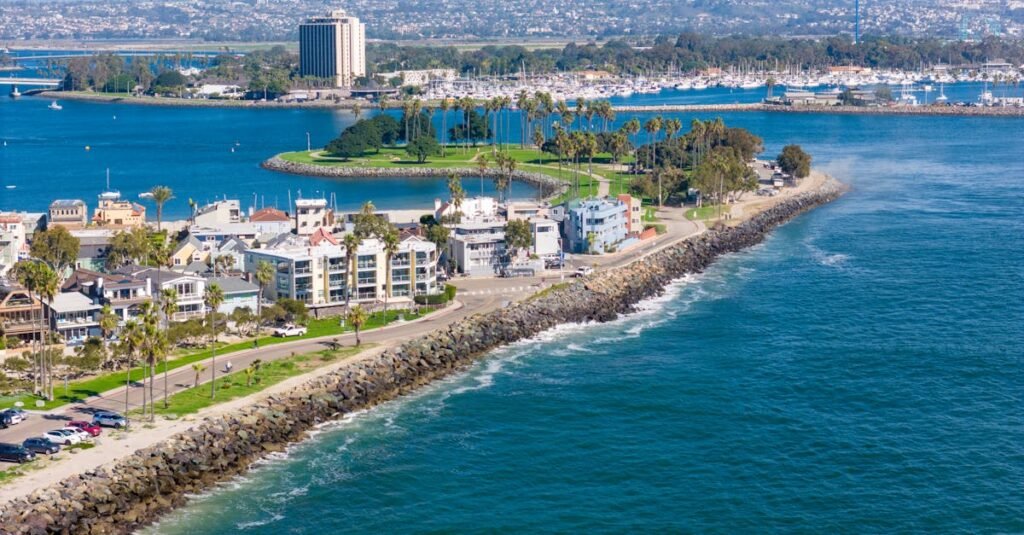 Stunning drone shot of San Diego's coastline, showcasing urban cityscape and ocean views.