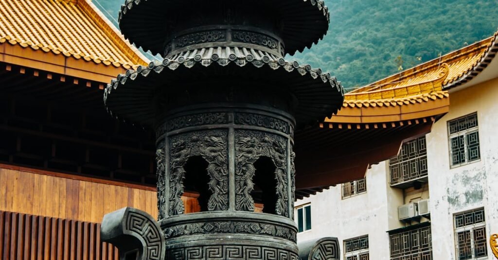 Intricately carved incense burner at a traditional temple in Shenzhen, China.